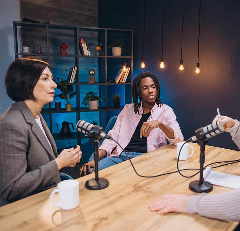 podcasters interviewing a guest in a studio